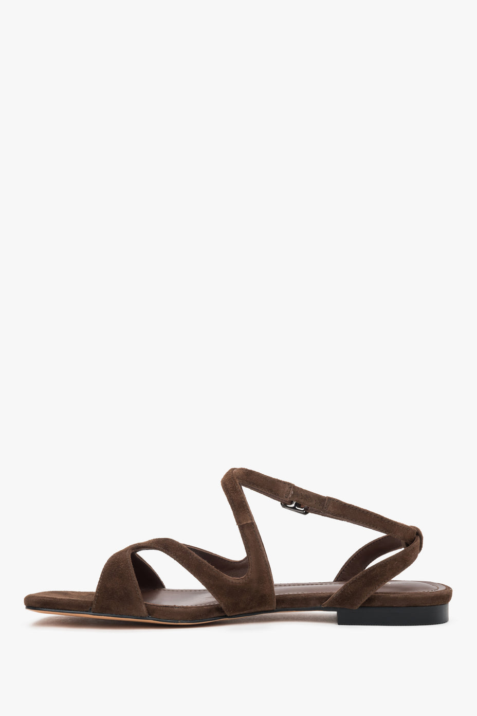 Side view of women’s saddle brown flat sandals.