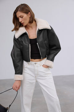Short women's black shearling-style jacket, Estro brand.