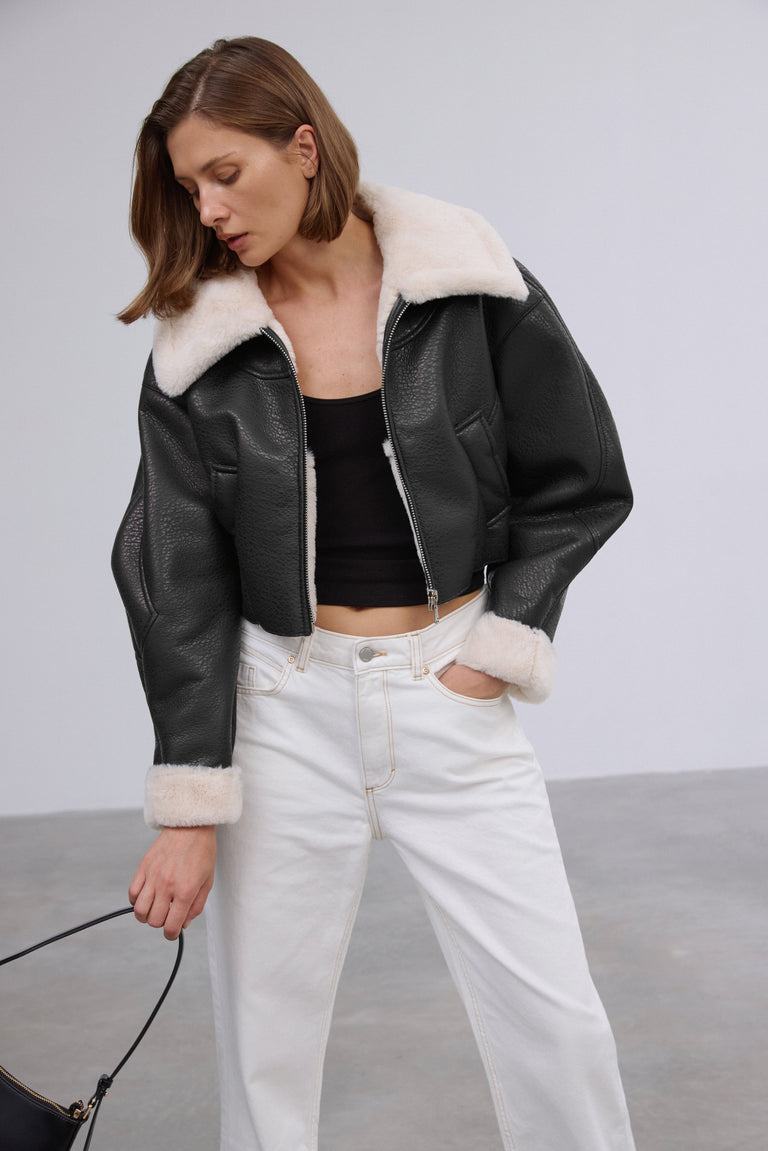 Short women's black shearling-style jacket, Estro brand.
