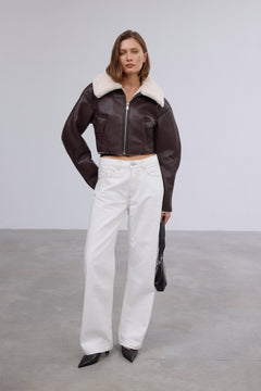 Stylish women's dark brown shearling jacket by Estro made of faux leather and faux fur.
