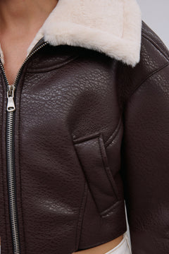 Women's dark brown faux leather shearling jacket with soft fur trim by Estro.