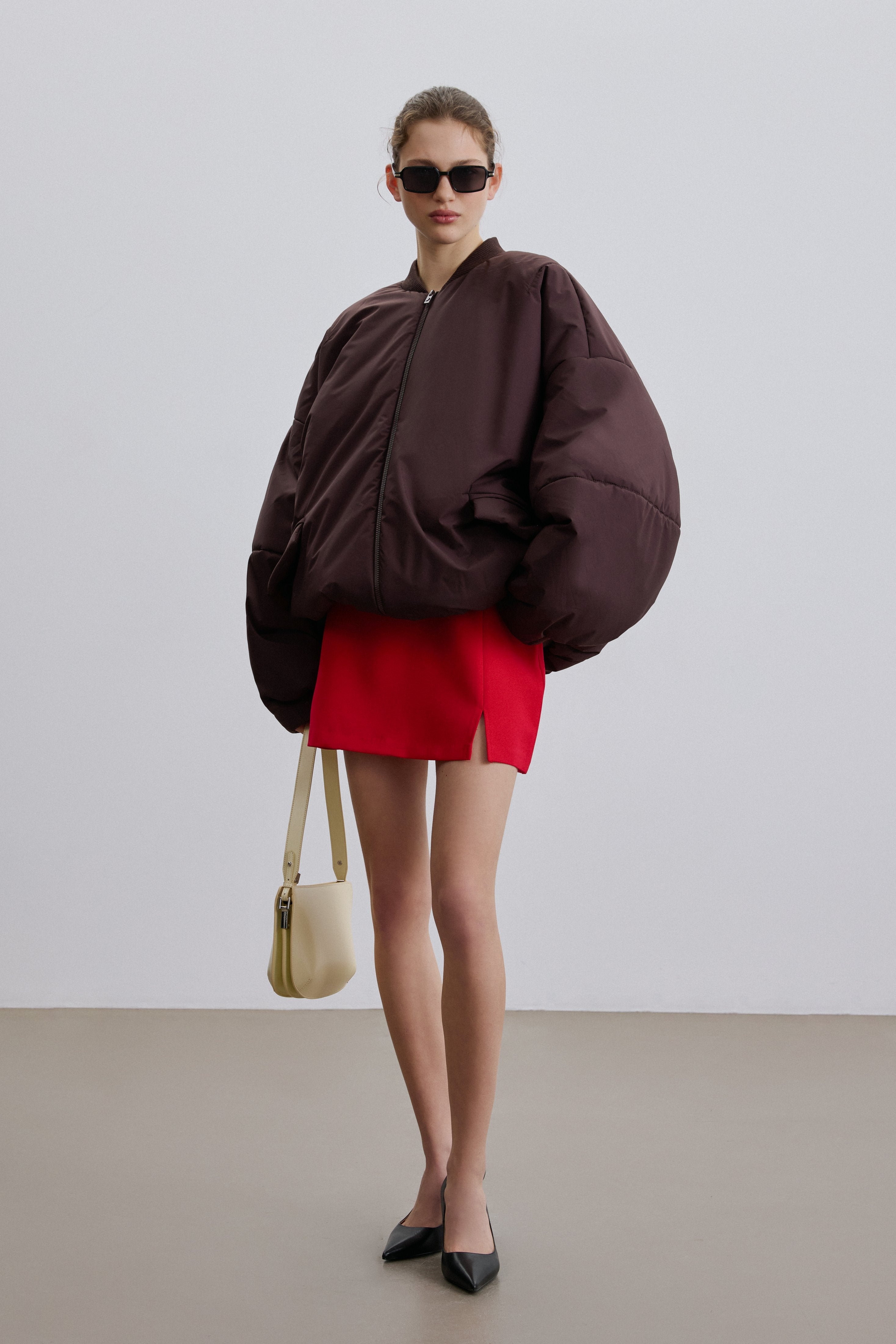 Side view showing long sleeves and practical pockets.