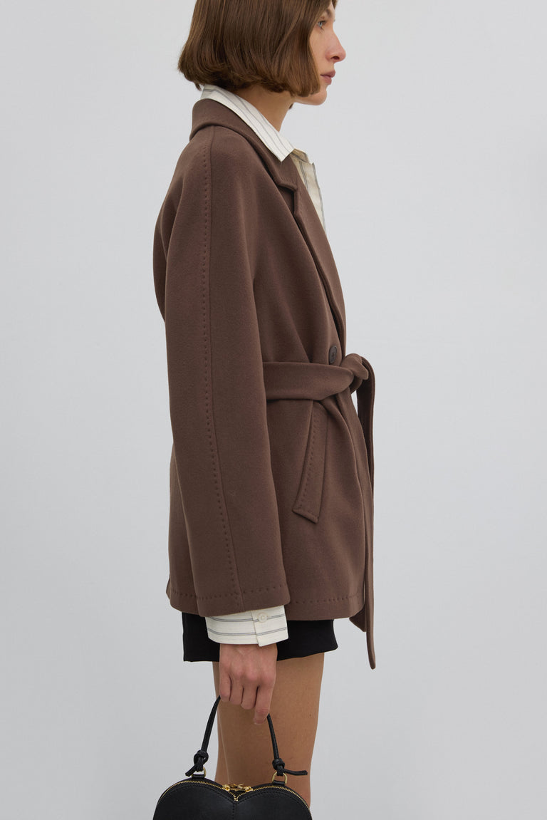 Short, double-breasted women’s wool coat in brown.