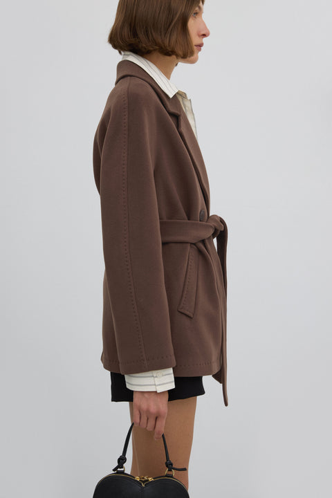 Short, double-breasted women’s wool coat in brown.