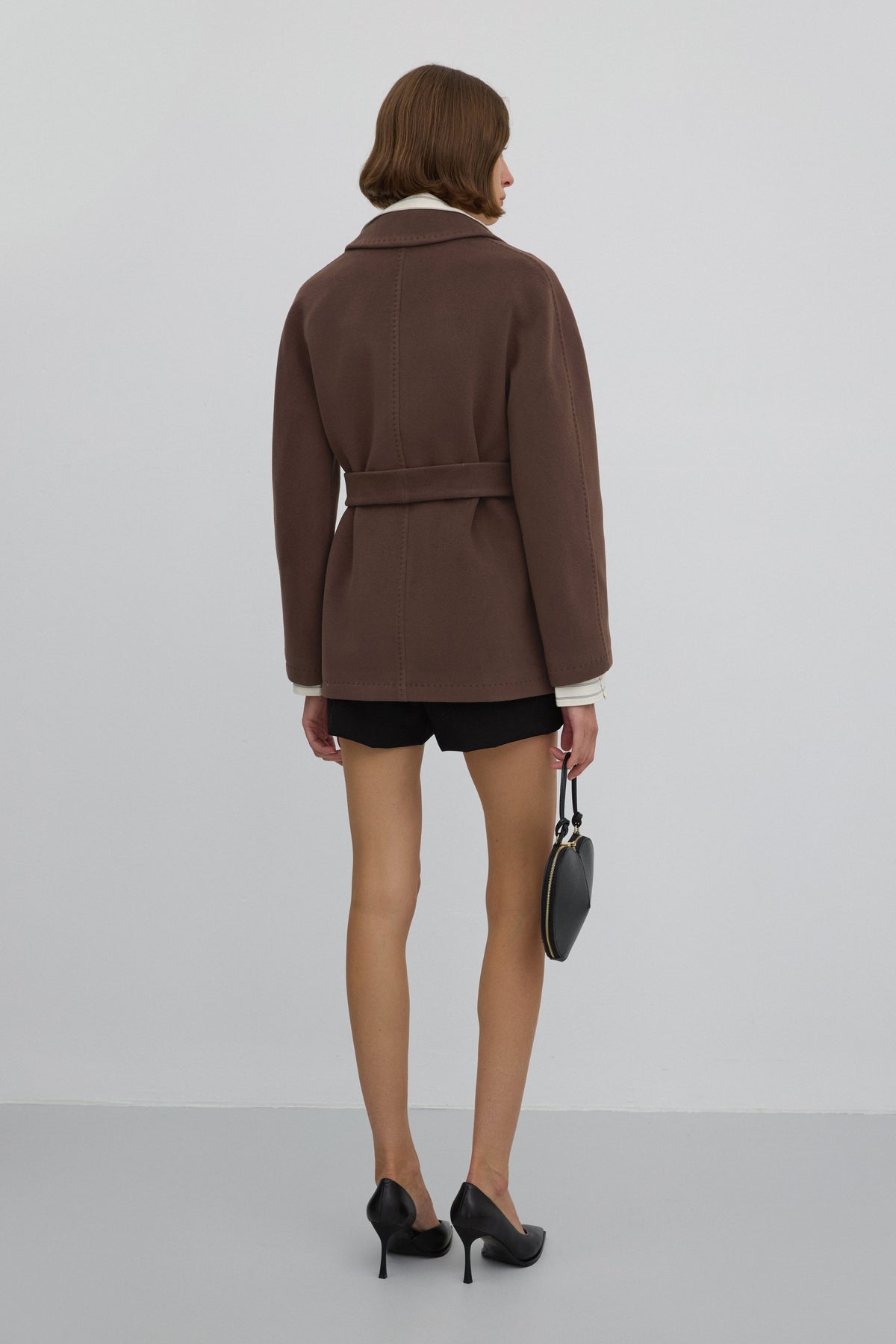 With wool — short, double-breasted brown women’s coat by Estro.