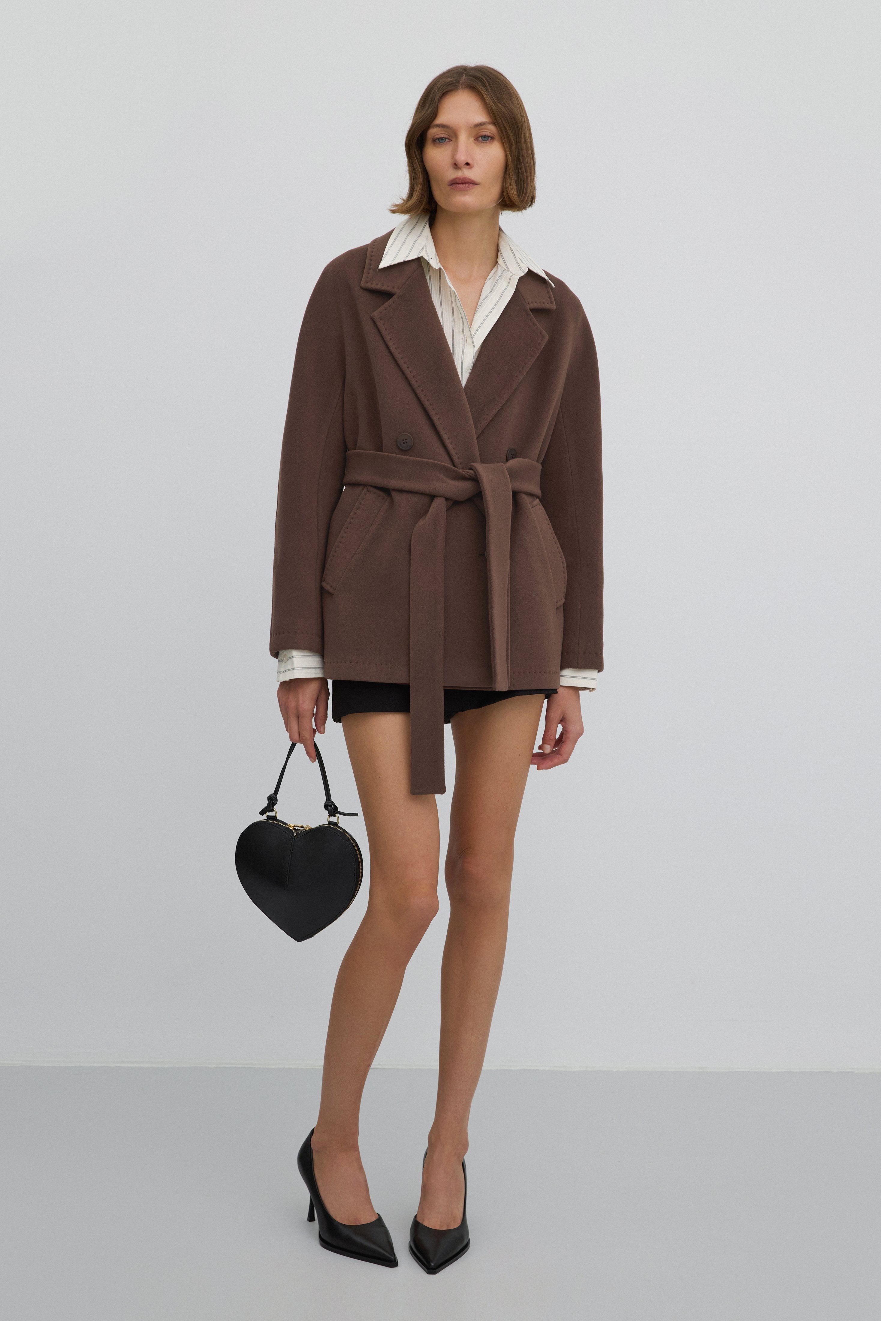 Double-breasted women’s wool coat in brown.