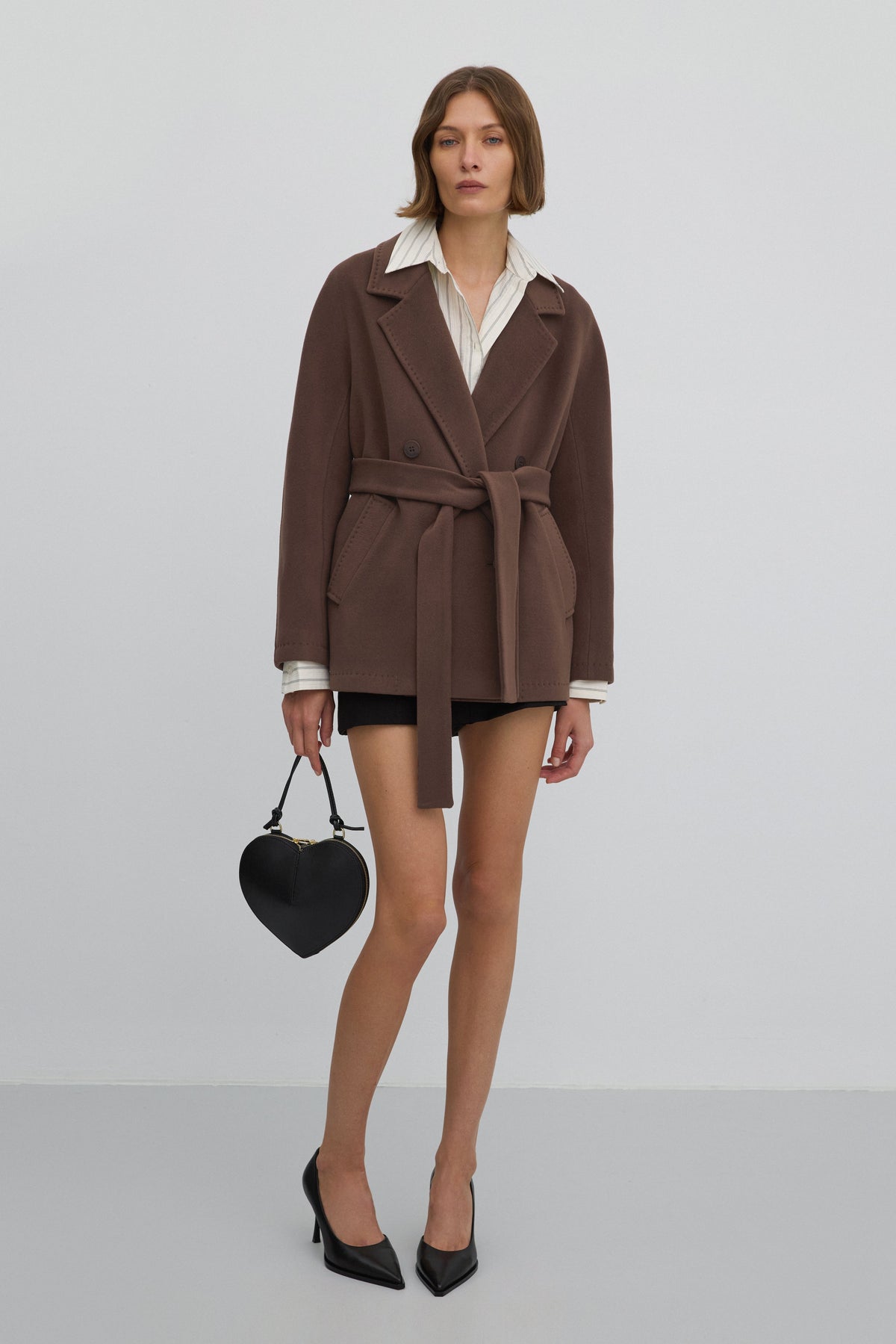 Double-breasted women’s wool coat in brown.