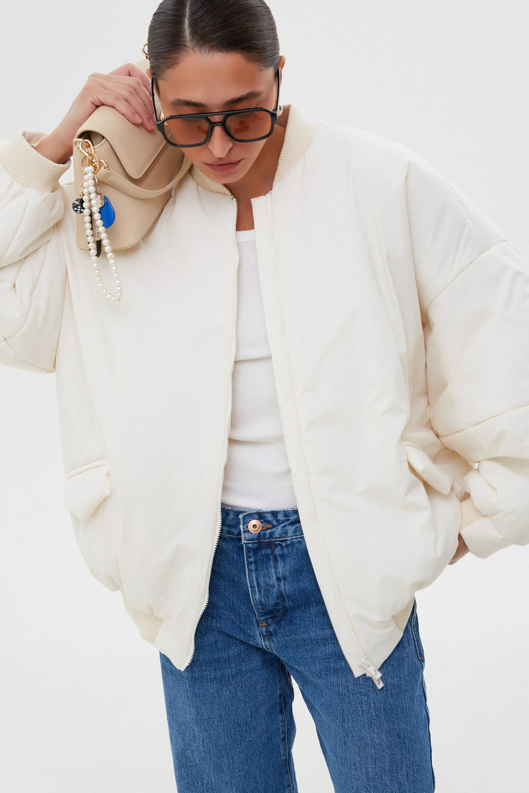 Oversize short milk-white women’s bomber jacket with a stand collar Estro.
