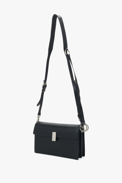 Small black crossbody bag for women in genuine leather with silver hardware.
