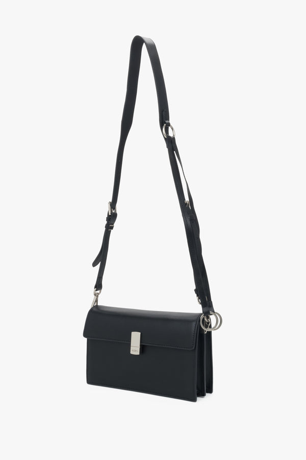 Small black crossbody bag for women in genuine leather with silver hardware.