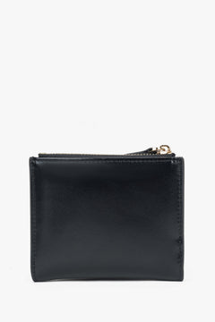 Small black women's wallet made of genuine leather.