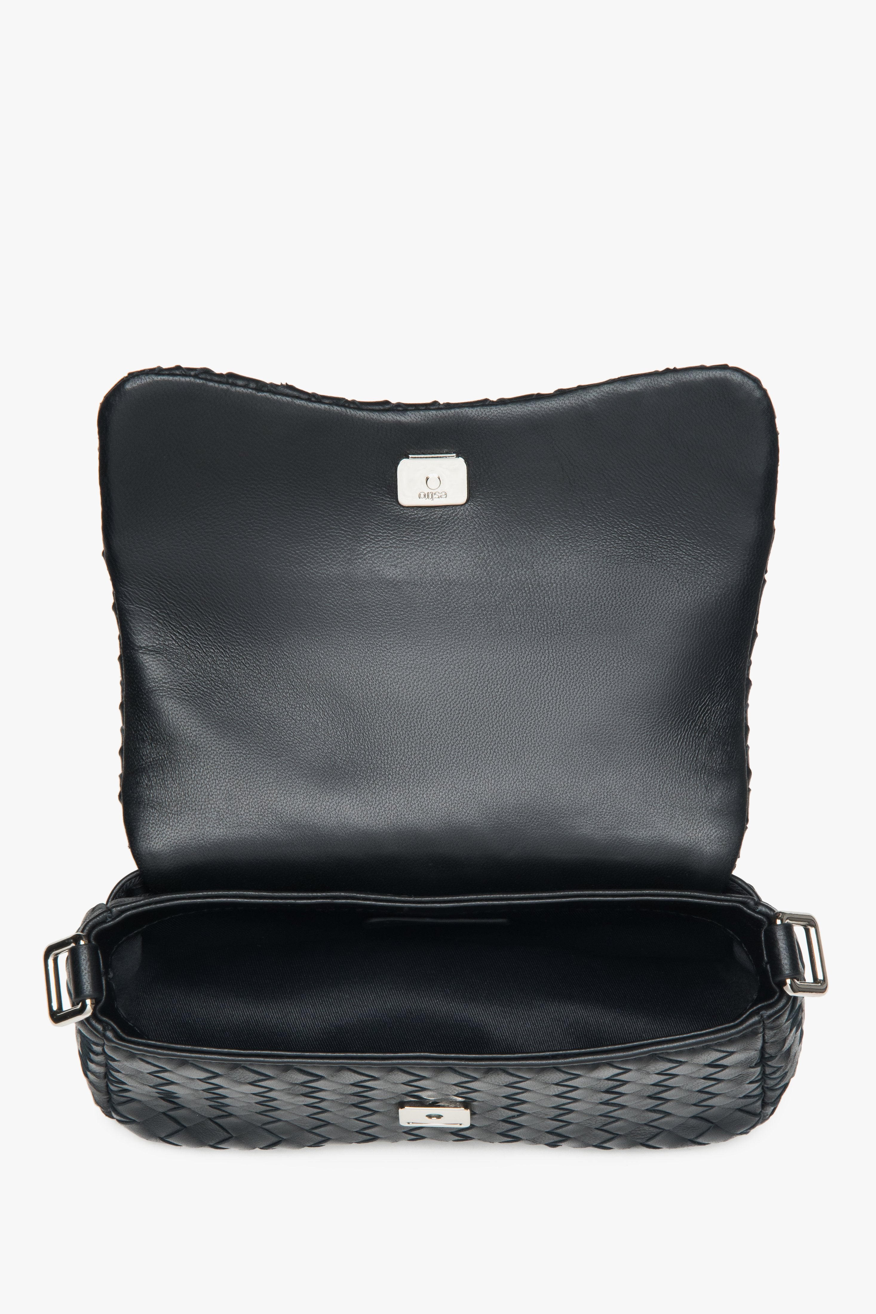 Black women’s shoulder bag made of woven genuine leather.