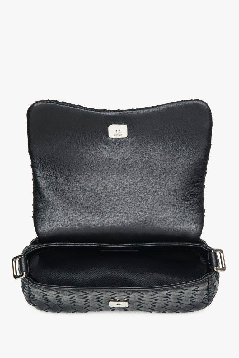 Black women’s shoulder bag made of woven genuine leather.