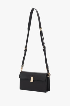 Dark brown leather crossbody bag for women with two compartments and gold hardware, Estro.