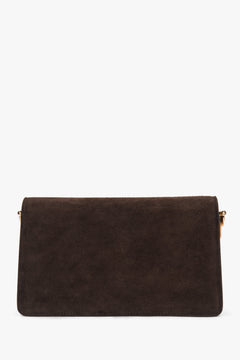 Small dark brown women’s shoulder bag made of genuine velour.