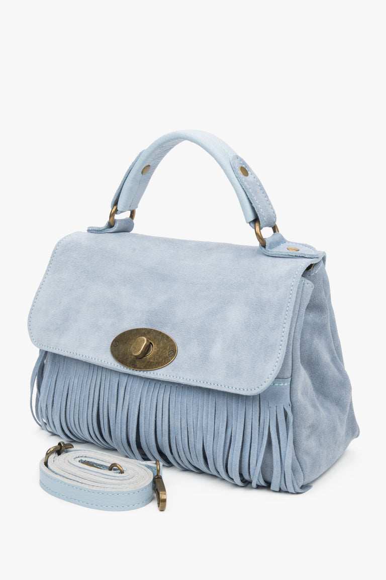 Small women's handbag made of natural velour in a blue color.