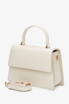 Elegant milky beige leather satchel for women with a structured silhouette.