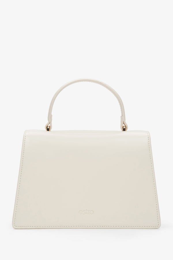 Small light beige leather handbag featuring a gold-tone snap closure and leather lining.