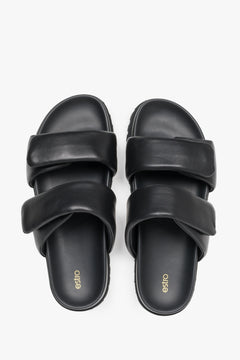 Stylish black women's slides by Estro, made from high-quality genuine leather and featuring soft, delicate straps.