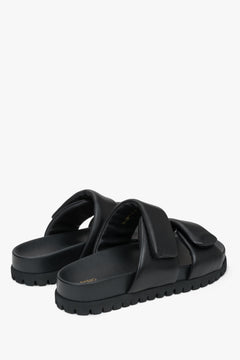 Black leather slides by Estro, perfect for summer, with soft straps that provide comfort all day long.