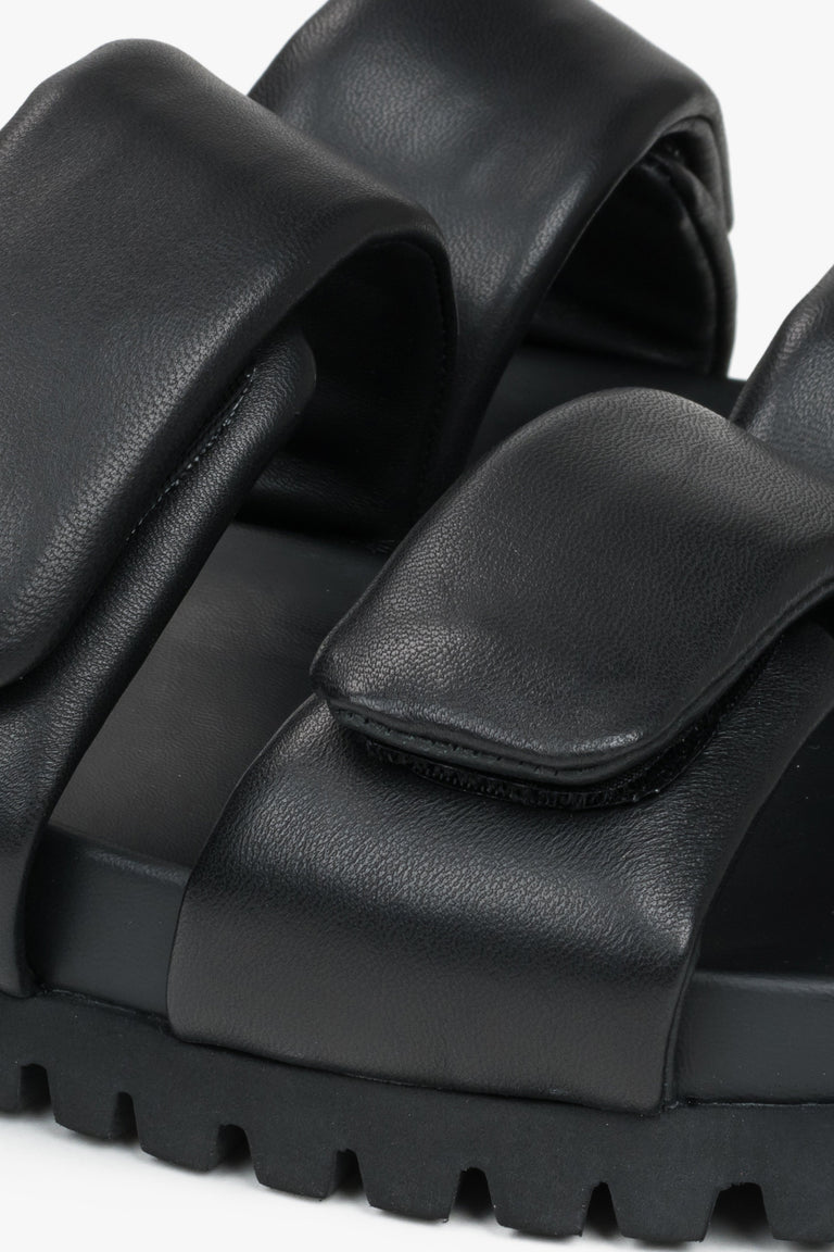 Black leather women's slides by Estro - a combination of genuine leather and soft straps - close-up of the details.