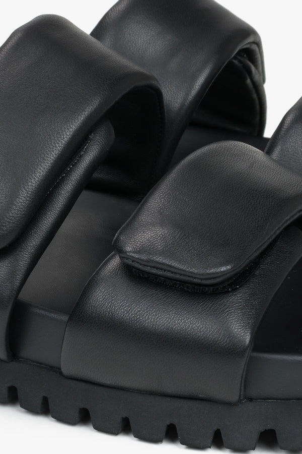 Black leather women's slides by Estro - a combination of genuine leather and soft straps - close-up of the details.