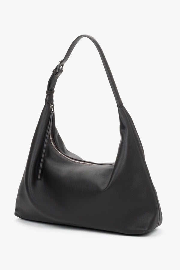 Elegant dark brown leather shopper featuring a secure zipper and adjustable strap.