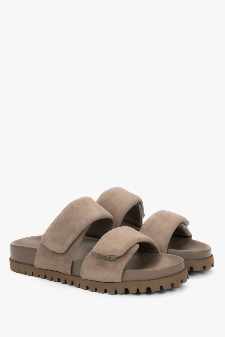 Angled view of women's taupe velour slide sandals with flat sole