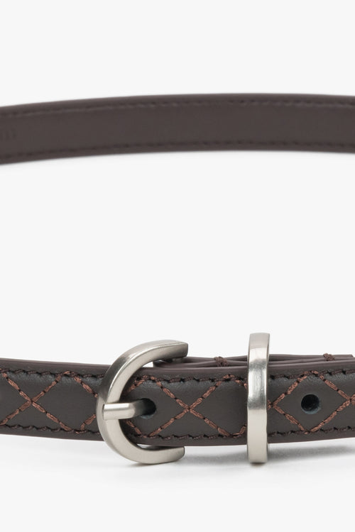 Thin dark brown leather belt with embossed braided pattern.