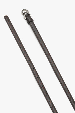 Embossed braided pattern on a dark brown natural leather belt.