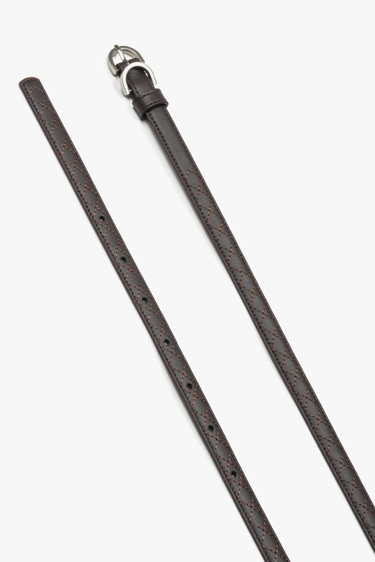 Embossed braided pattern on a dark brown natural leather belt.