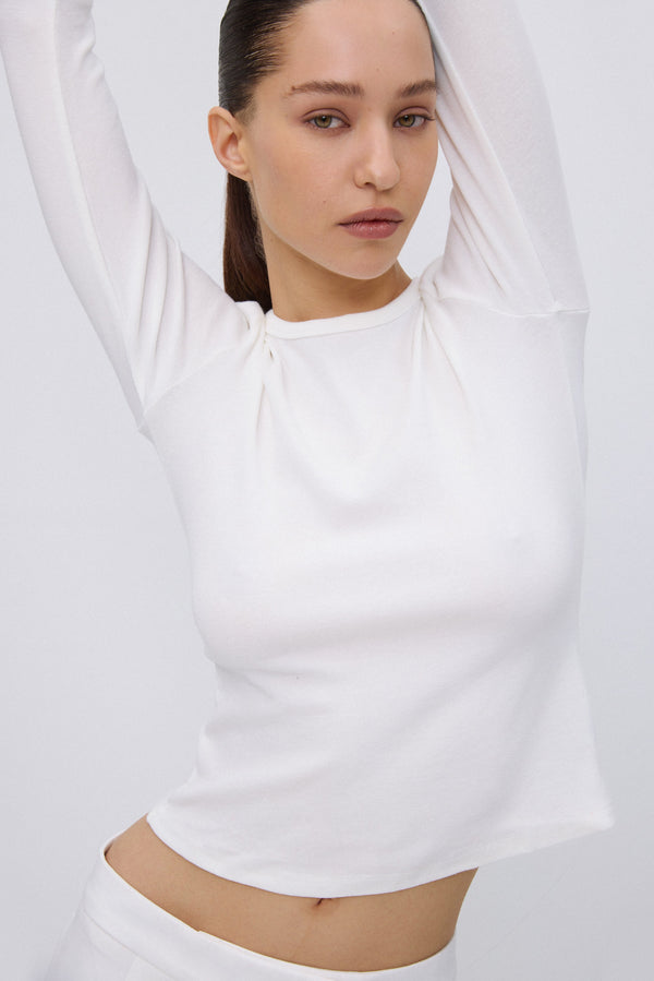 Close-up of soft white cotton fabric texture.