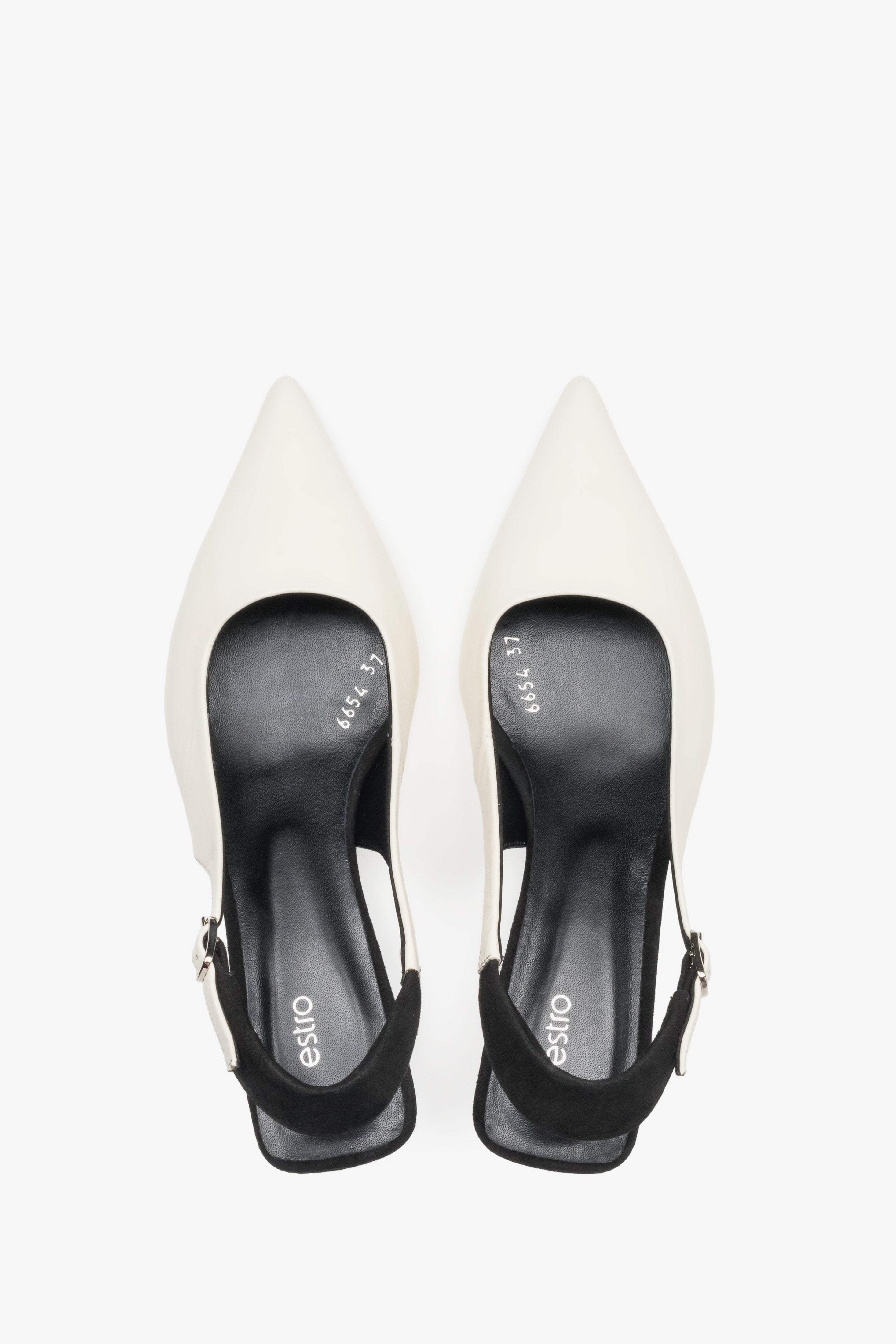 Top view of women’s white and black leather slingback heels by Estro.