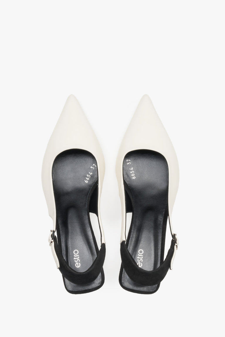 Top view of women’s white and black leather slingback heels by Estro.