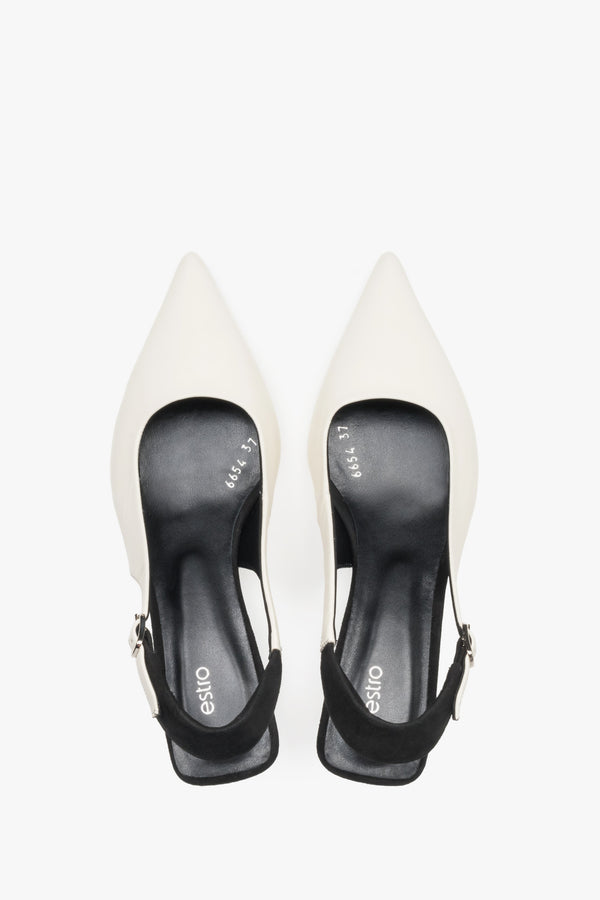 Top view of women’s white and black leather slingback heels by Estro.