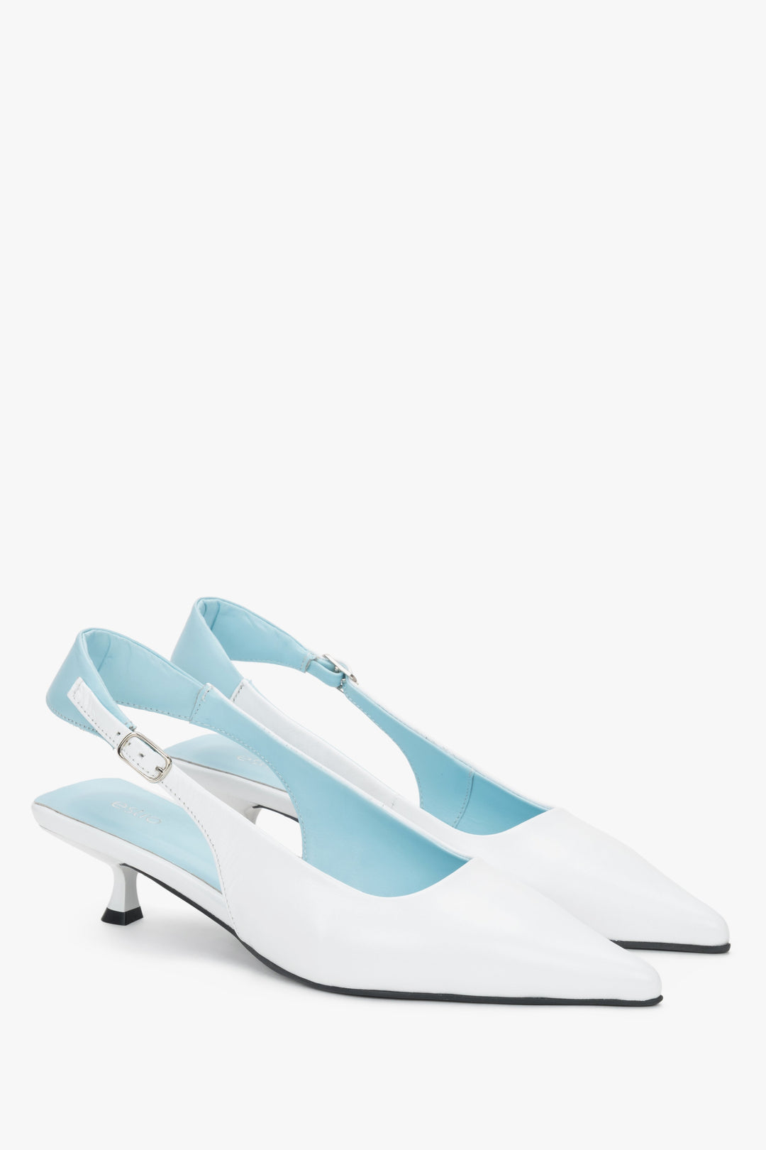 Side view of women’s white leather kitten heels with blue slingback strap.