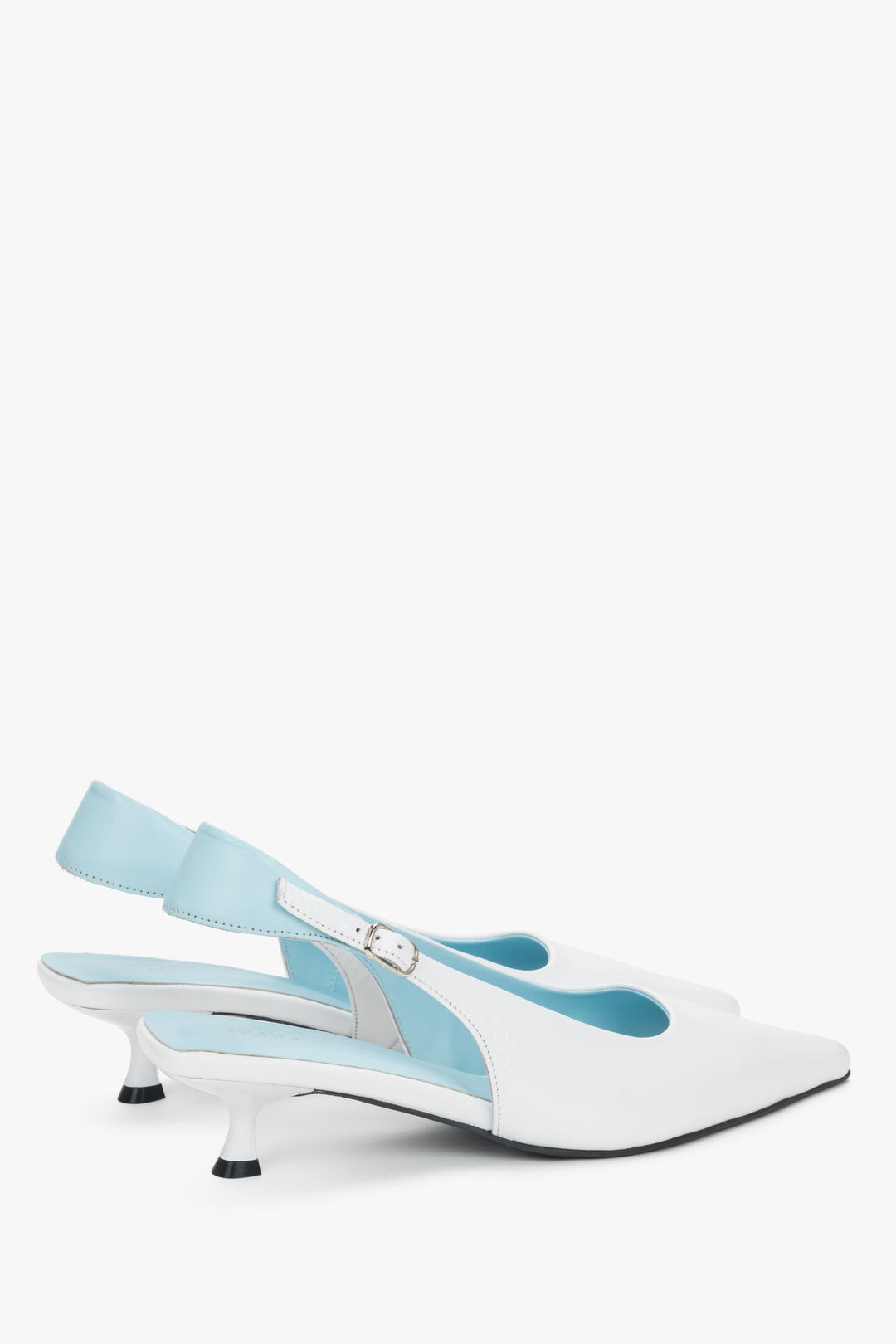 Detail view of the blue strap and buckle on white leather kitten heels.