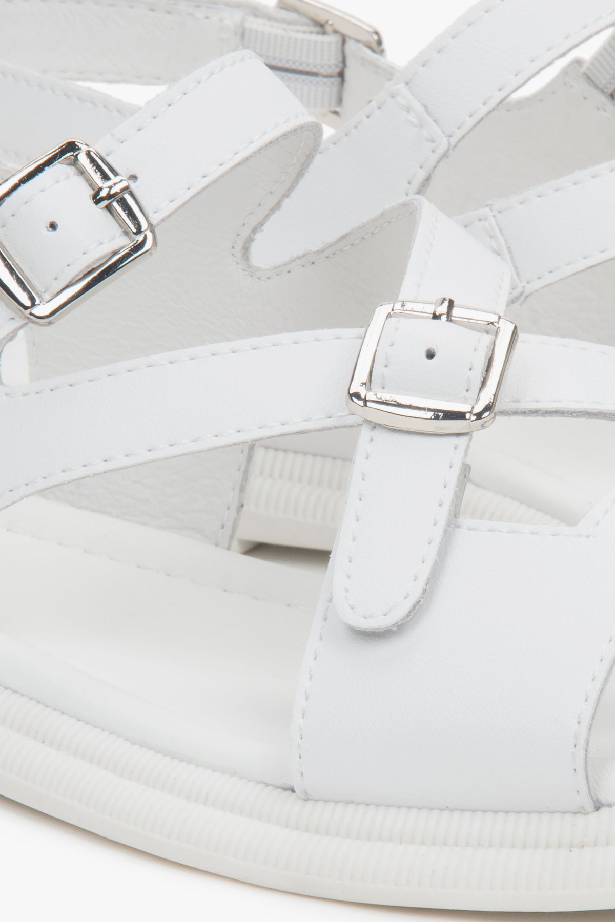 White women’s flat sandals by Estro – details.