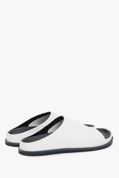 Made of genuine leather, white women’s slide sandals on a flat sole Estro.