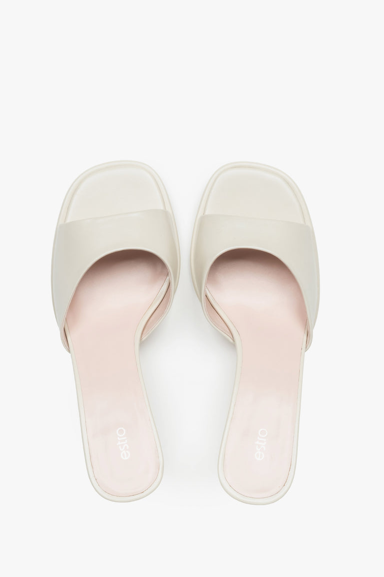 White heeled mules made of genuine leather.