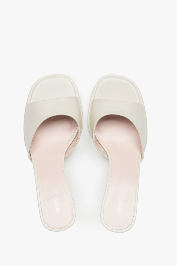 White heeled mules made of genuine leather.