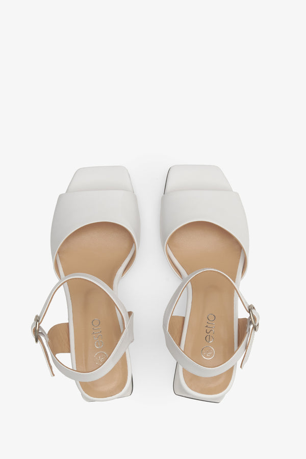 Women's white leather sandals by Estro - top-down view of the footwear presentation.