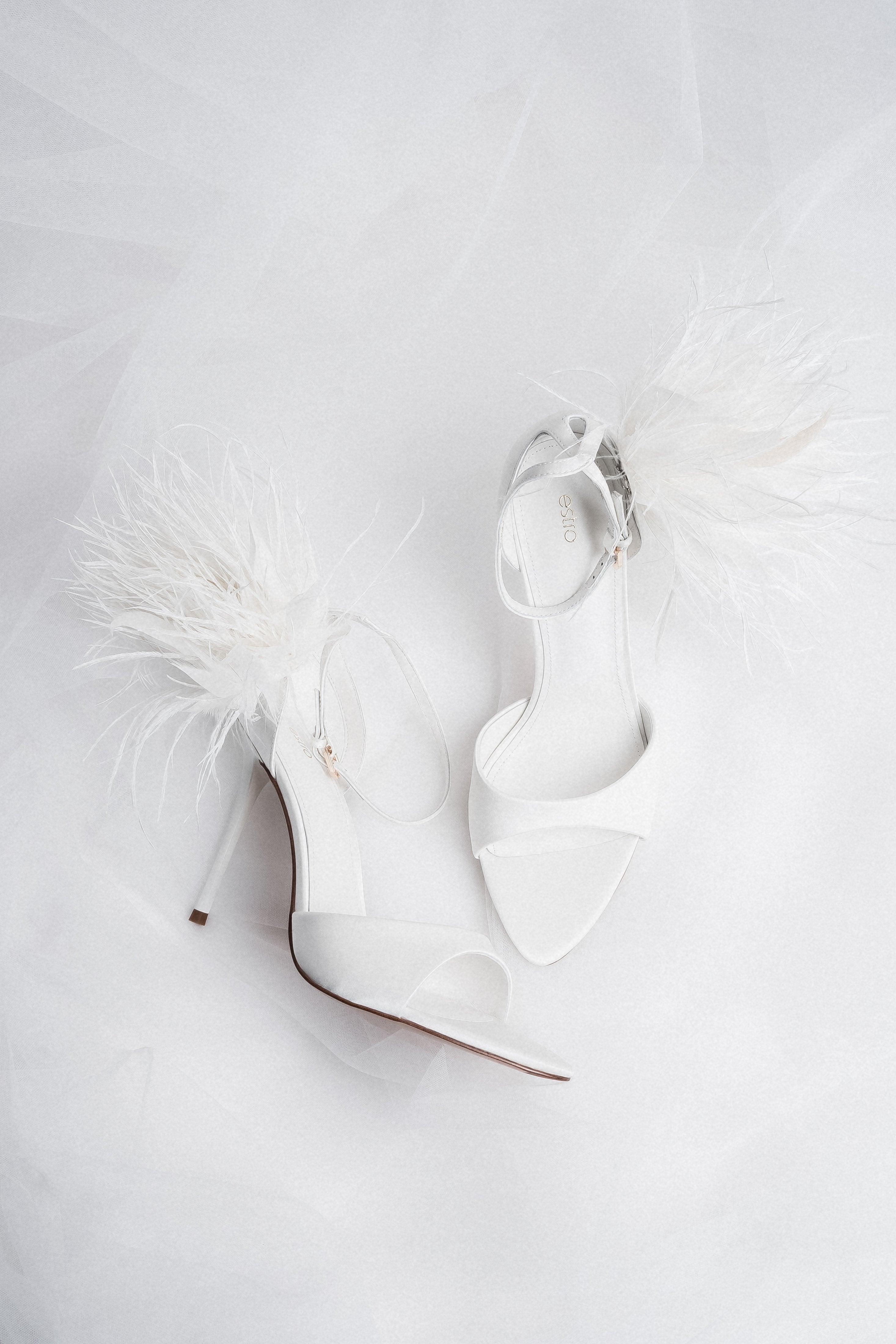 Women's white high heel sandals with delicate straps by Estro