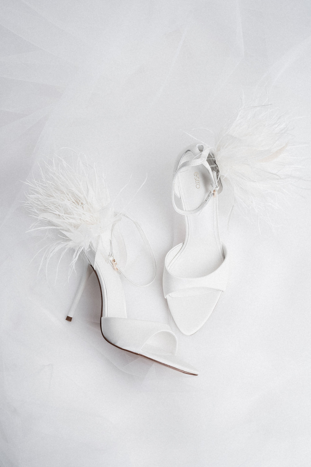 Women's white high heel sandals with delicate straps by Estro
