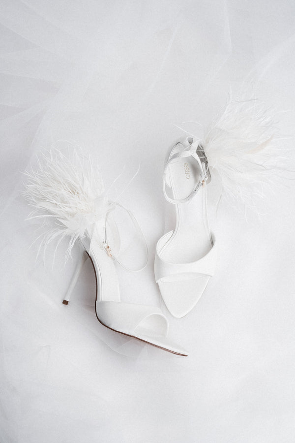 Women's white high heel sandals with delicate straps by Estro