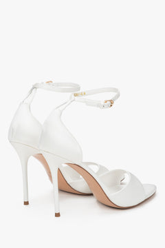 Back view of women's white high heel sandals with ankle strap