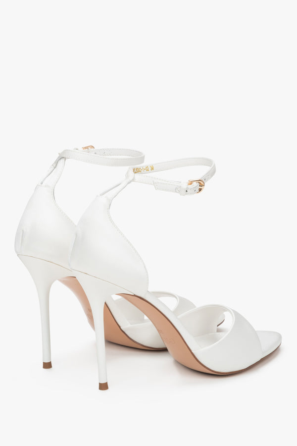 Back view of women's white high heel sandals with ankle strap