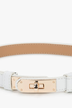 Women's white leather belt with a gold buckle.