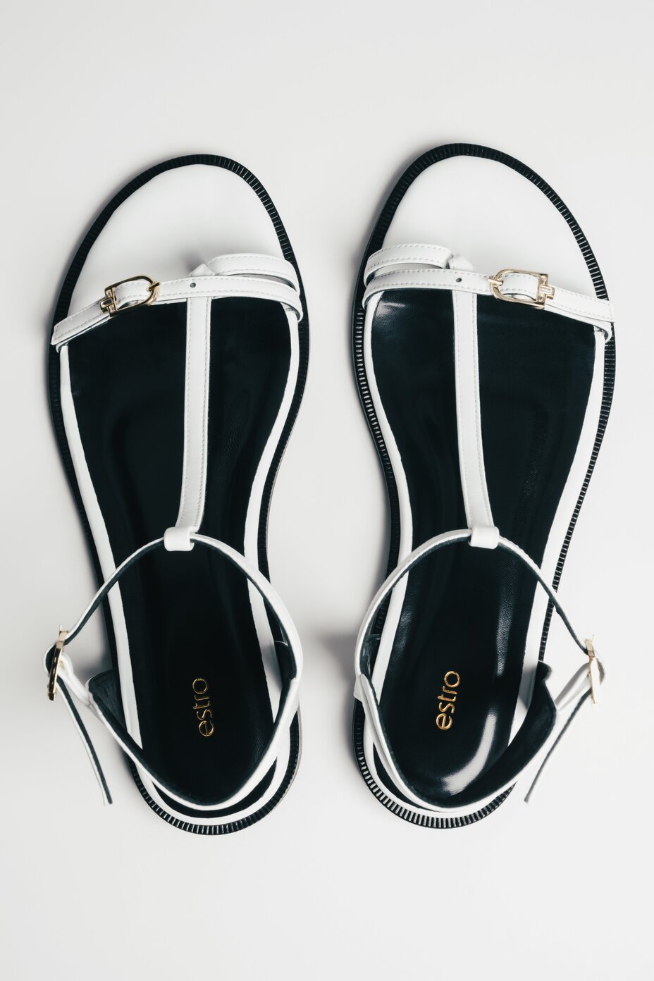 Women's white leather flat sandals with gold details by Estro