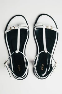 Women's white leather flat sandals with gold details by Estro